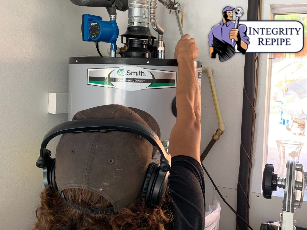 plumber Using Detection Wand in a water heater